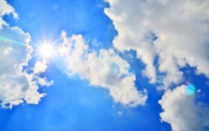blue sky with sun and clouds