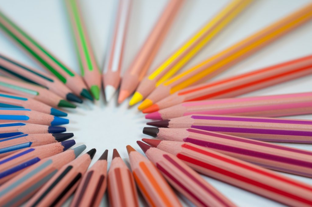 Circle of rainbow colored pencils