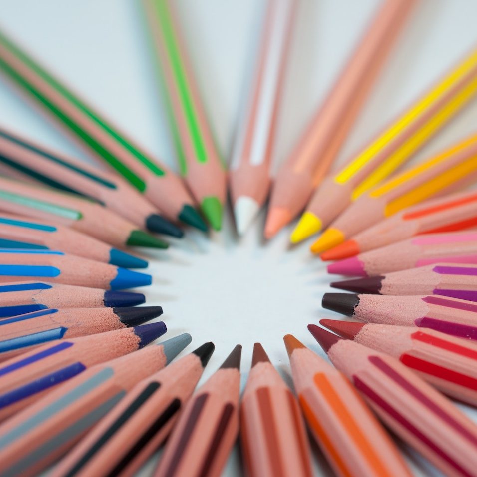 spectrum of colored pencils arranged in a circle