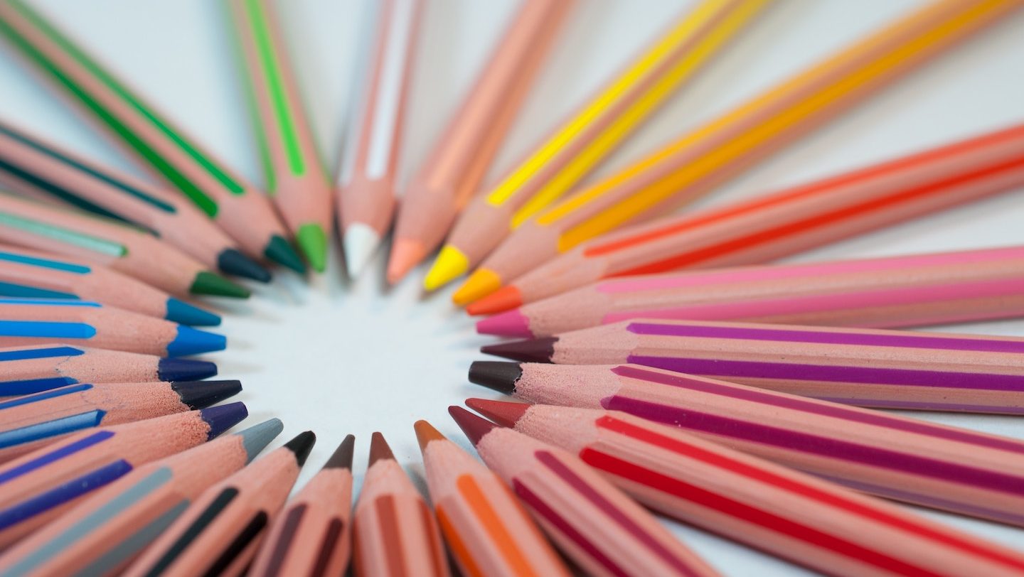 spectrum of colored pencils arranged in a circle